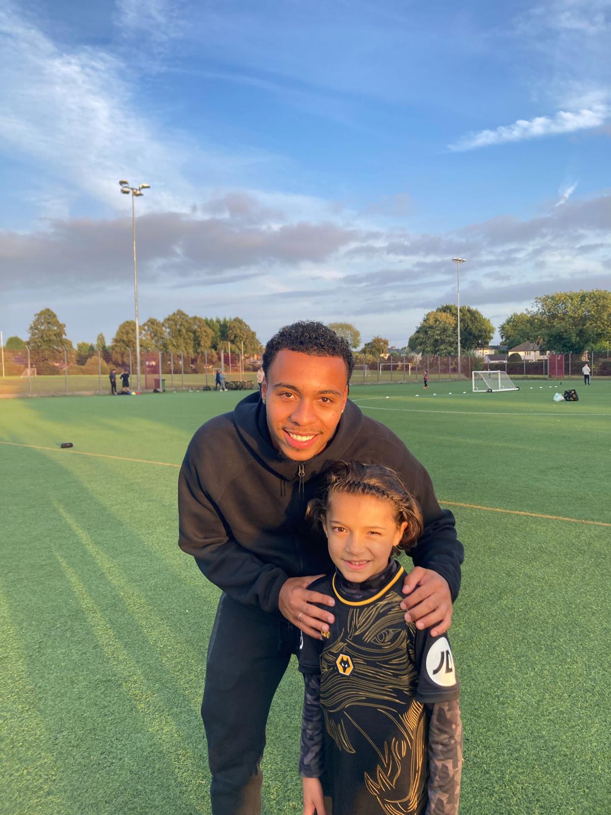 Xander with one of his coaches after a training session